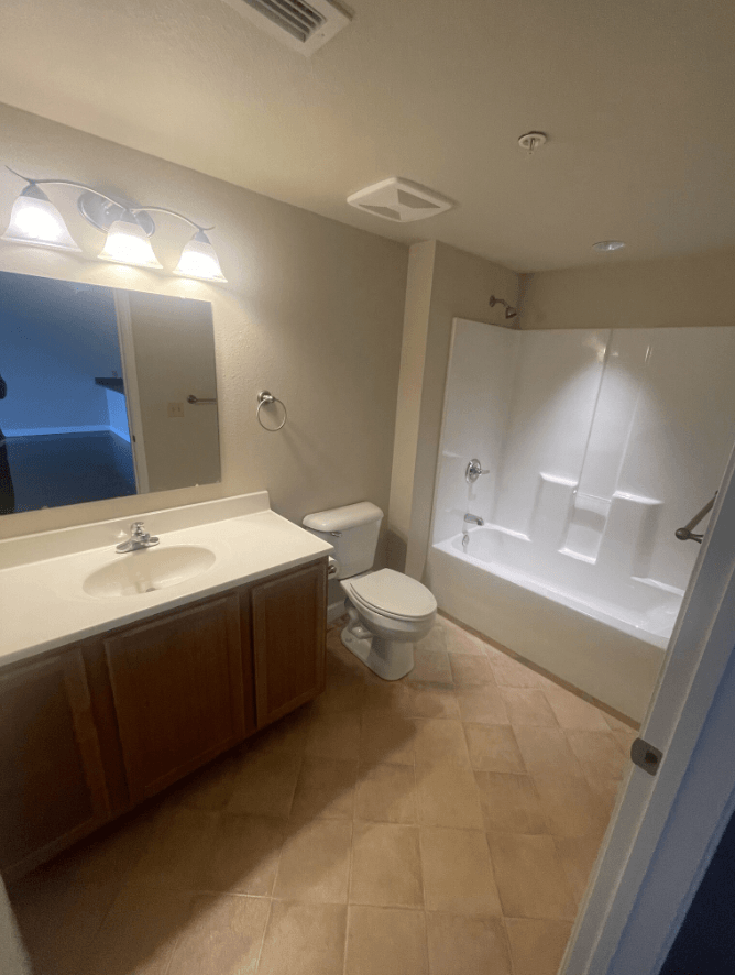 a bathroom with a sink toilet and a bath tub