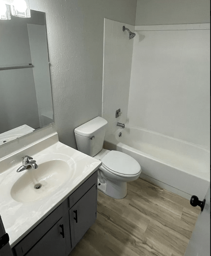 a bathroom with a sink toilet and a bath tub