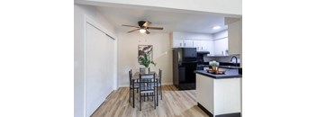 an open kitchen and dining room with a table and chairs