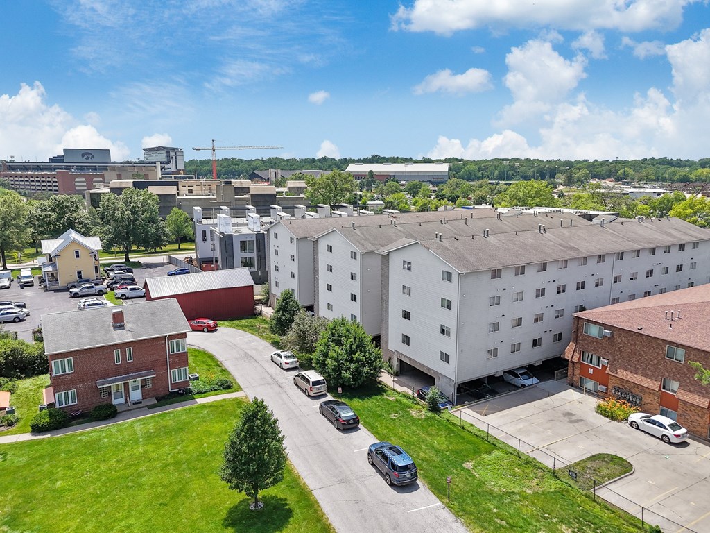 an aerial view of a large apartment building in a city