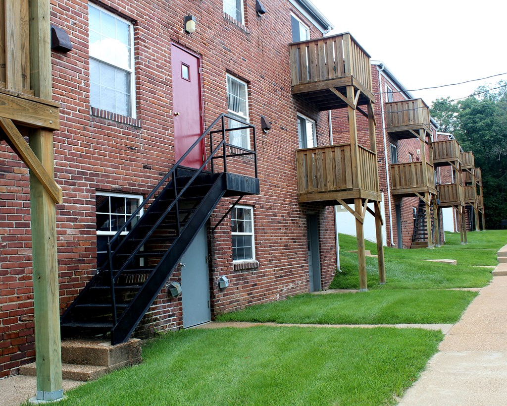a brick building with stairs on the side