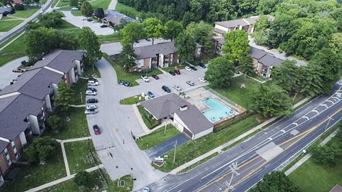 A residential area with houses and a swimming pool.