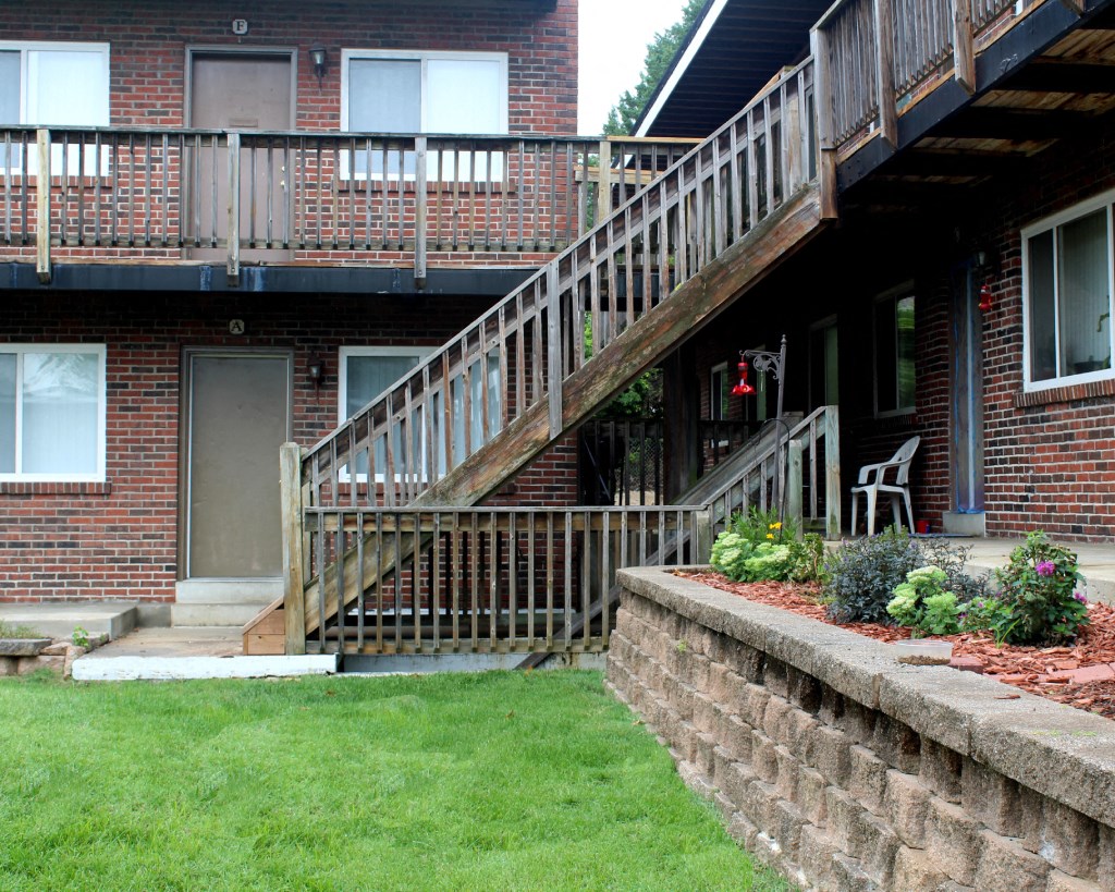 two sets of stairs outside of a brick building