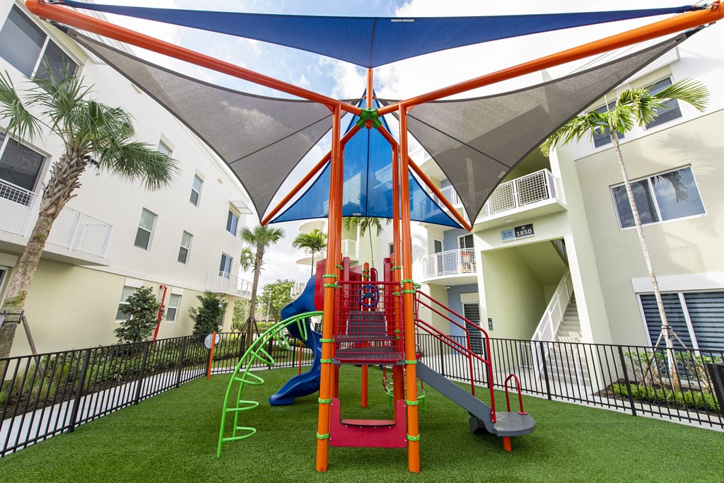 a playground at the resort with a swing set