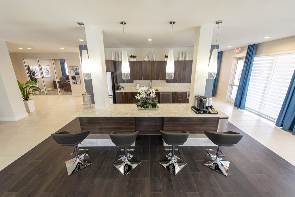 a kitchen and dining room with a table and chairs