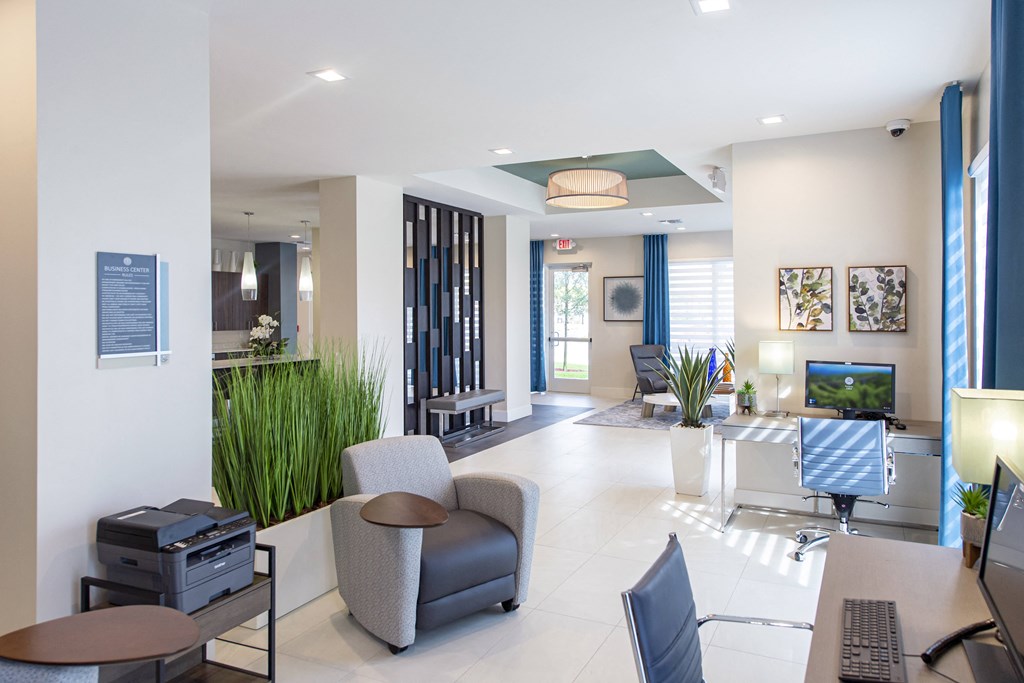 a living room with chairs and a table and a television