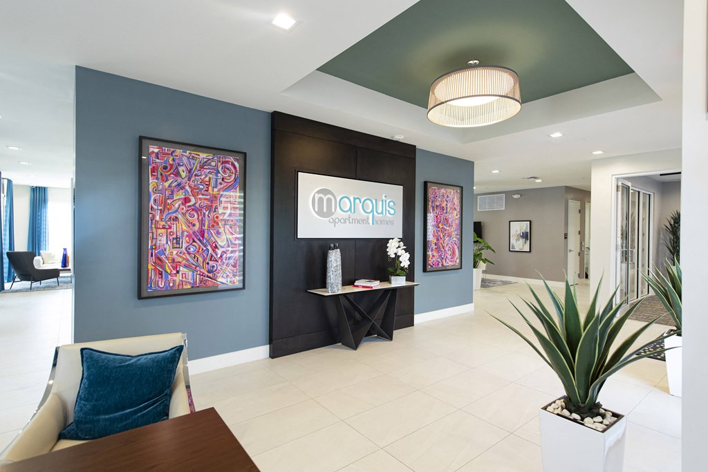 a lobby with blue walls and a table with chairs