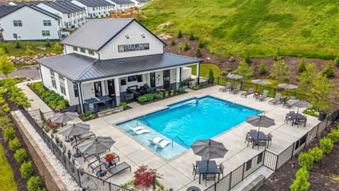 A pool area with a building that has a sign that says "Steel Island".