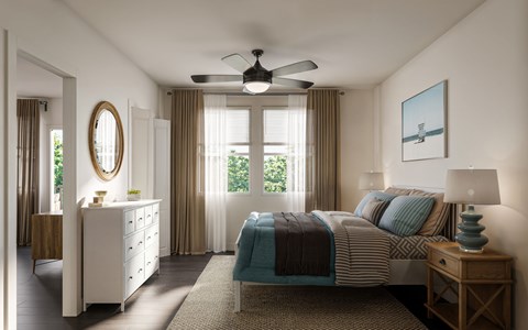 A bedroom with a bed, dresser, and window with curtains.