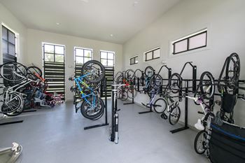 A room full of bicycles parked on stands.