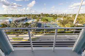 a view of a park from a balcony of a building