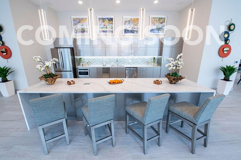 a kitchen with a large table and chairs