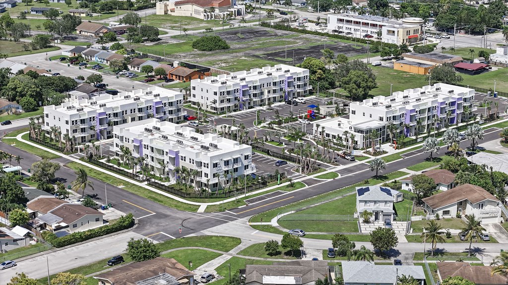 A view of a residential area with apartment buildings and houses.