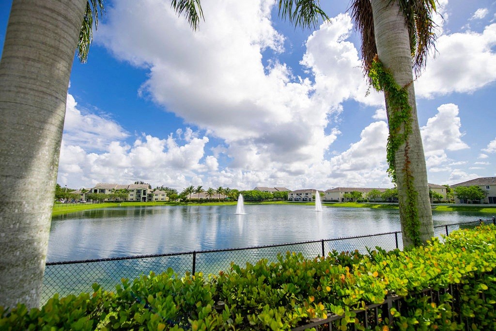 a view of a lake with sail boats on it