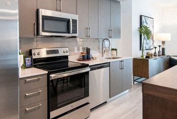 a kitchen with a stove and a microwave