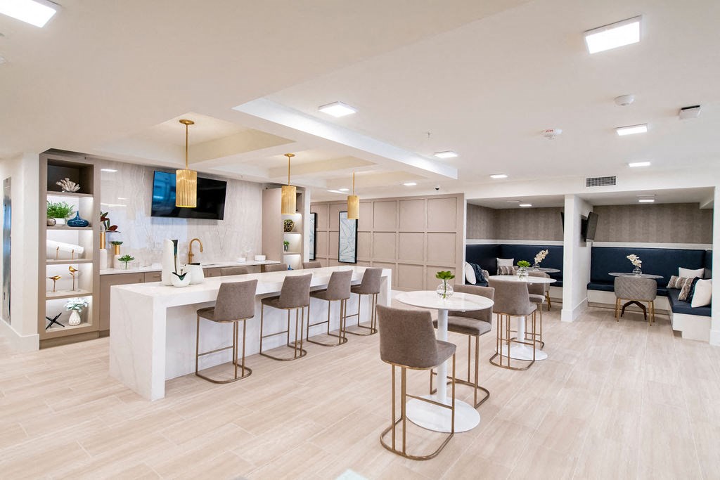 a resident clubhouse with a kitchen and lounge area