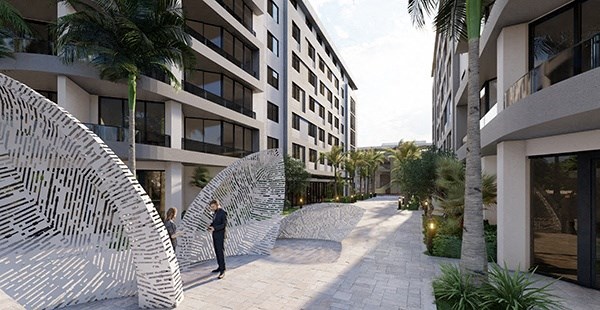 a man walking down a street next to a building
