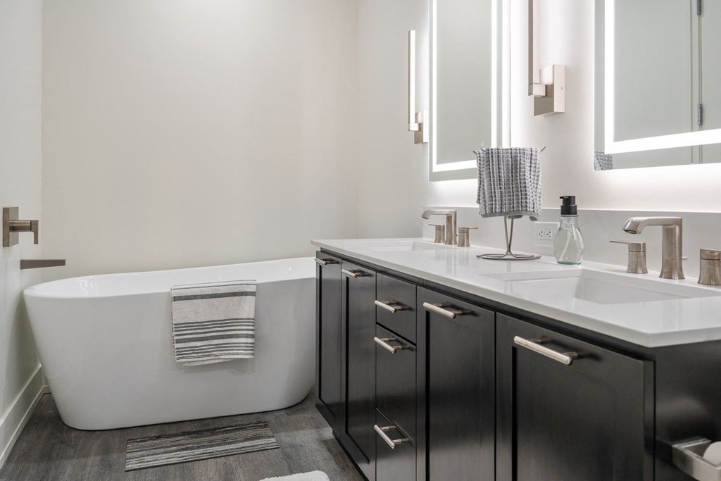 a bathroom with a sink and a bath tub