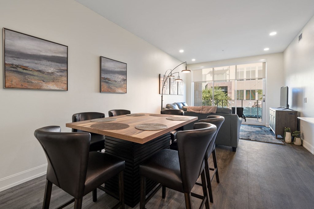 a dining room with a table and chairs