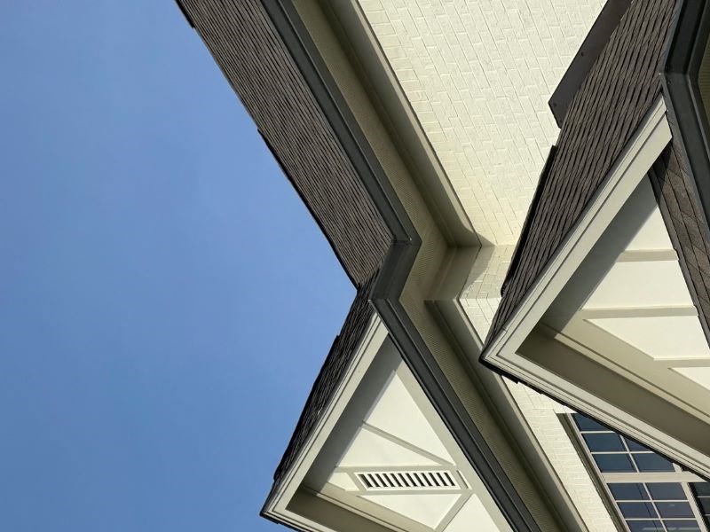 a view of a townhome building from the ground looking up into the sky