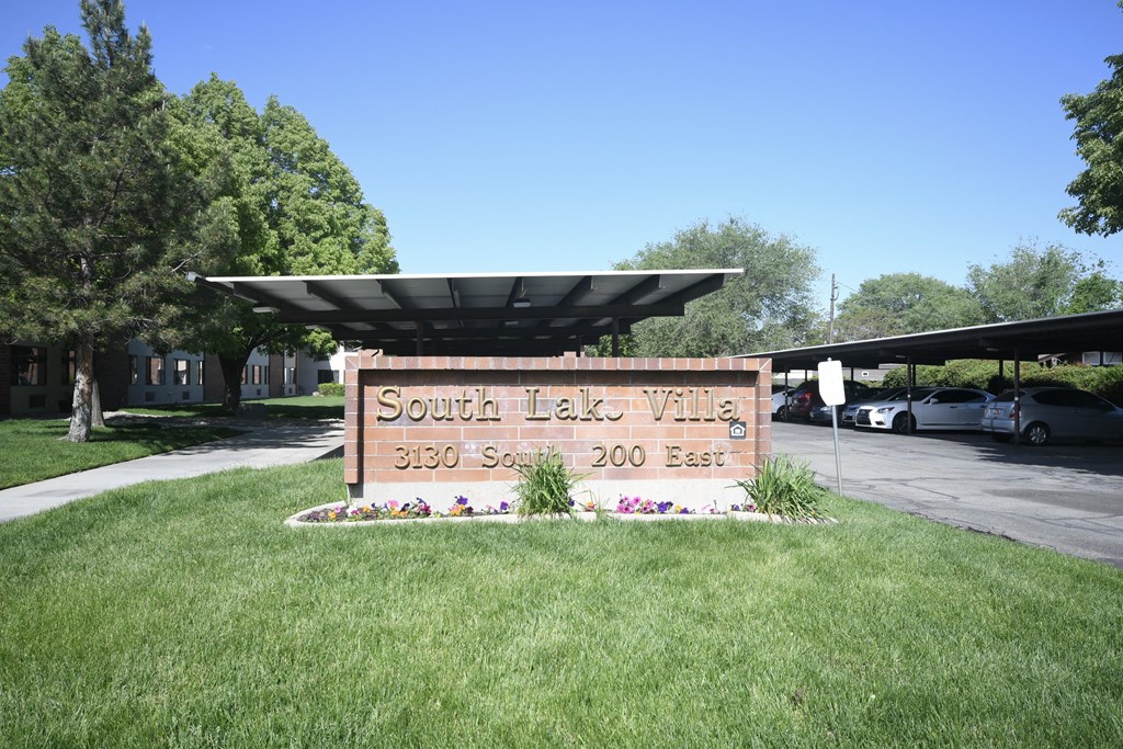the sign village in front of a parking lot