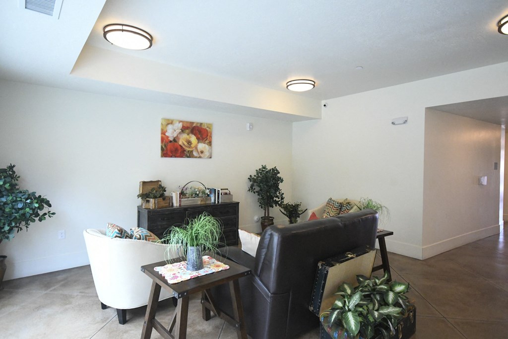 a living room with a couch and a chair and a table