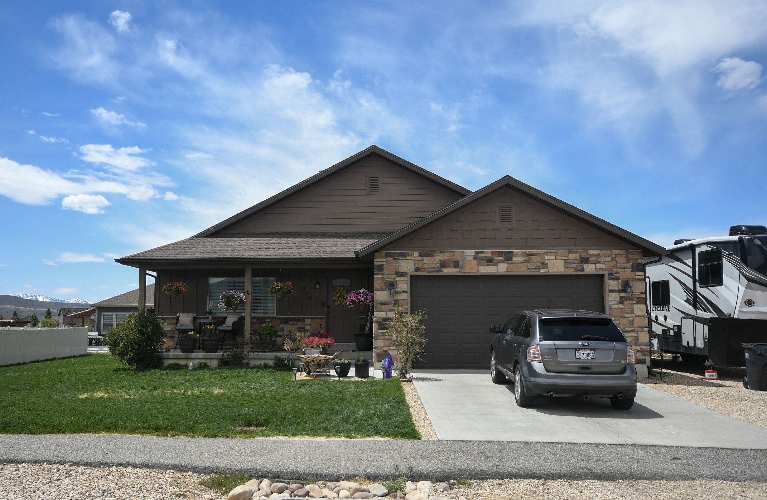 a house with a car parked in front of it