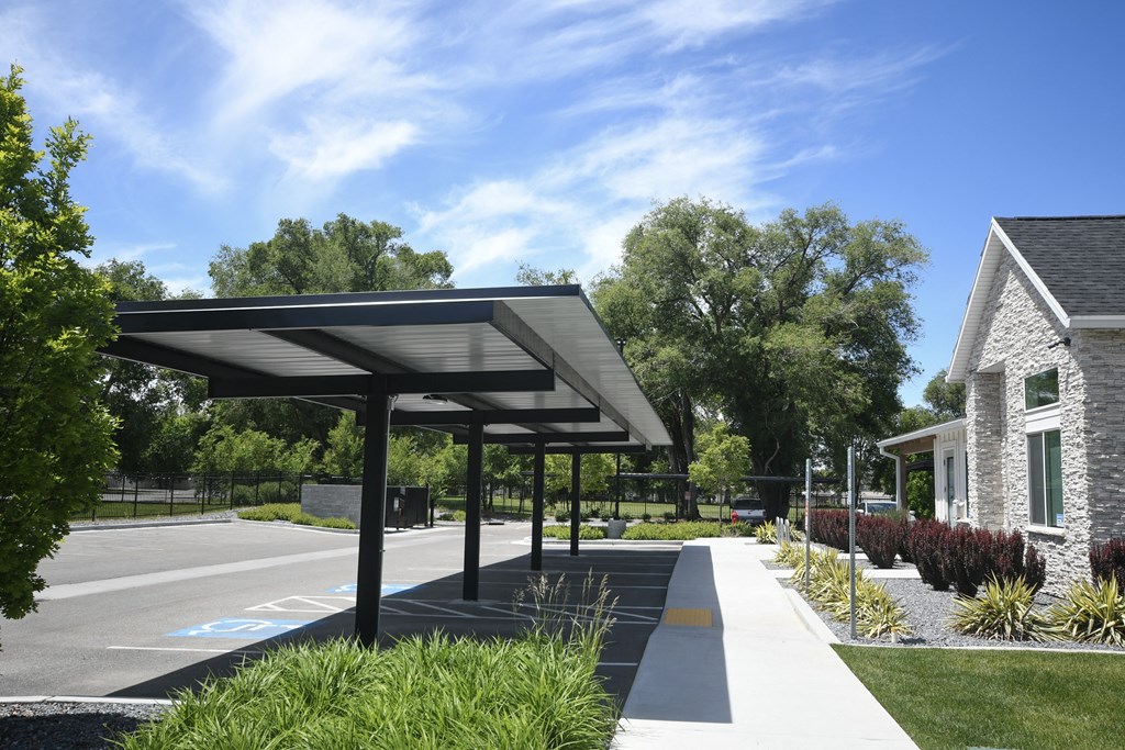 a patio with awnings in front of a house