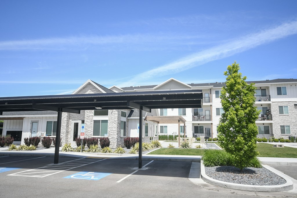 a parking lot in front of an apartment building