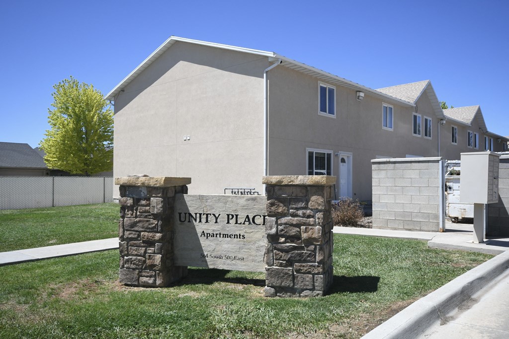 a unit placement sign in front of a building