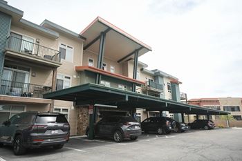 a garage with cars parked in front of a building