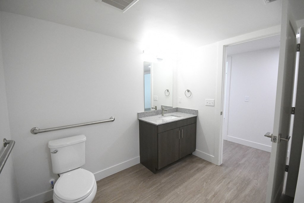 an empty bathroom with a toilet and a sink