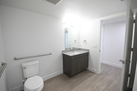 an empty bathroom with a toilet and a sink