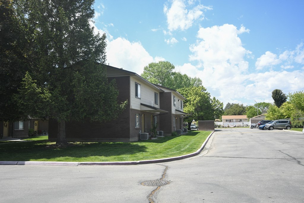 a row of houses on the corner of a street