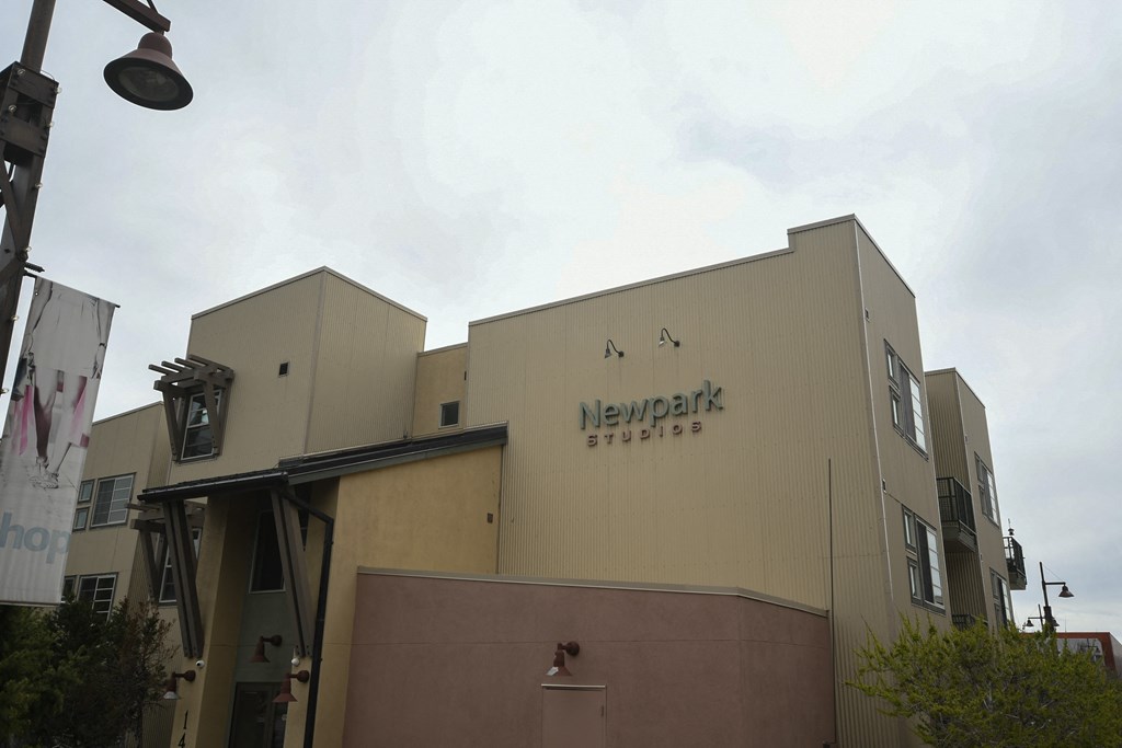 a view of the side of a building with a sign on it