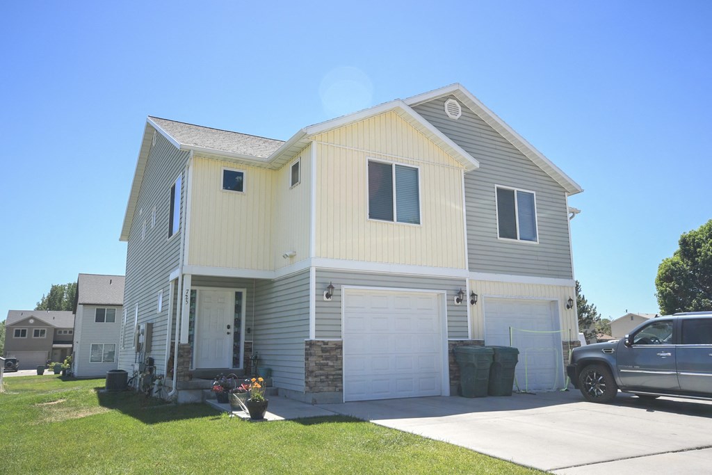 a house with a car parked in front of it