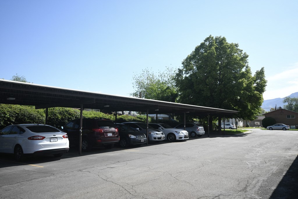 a row of cars parked in a parking lot