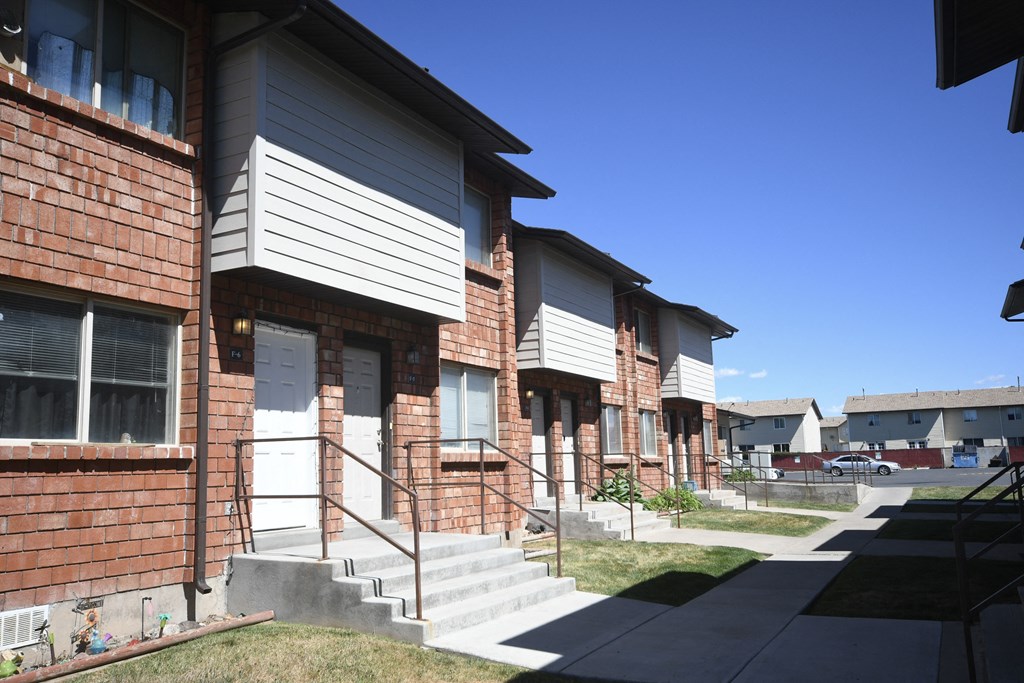 a row of houses with stairs in front of them