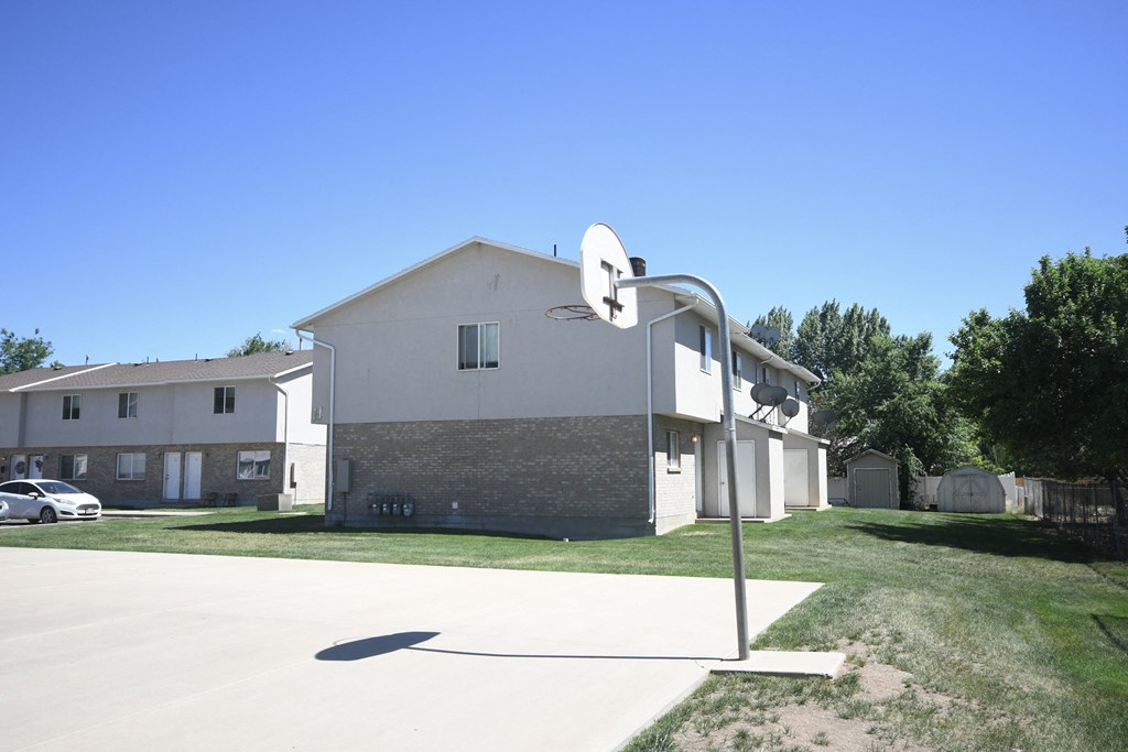 a large white building with a satellite antenna in front of it