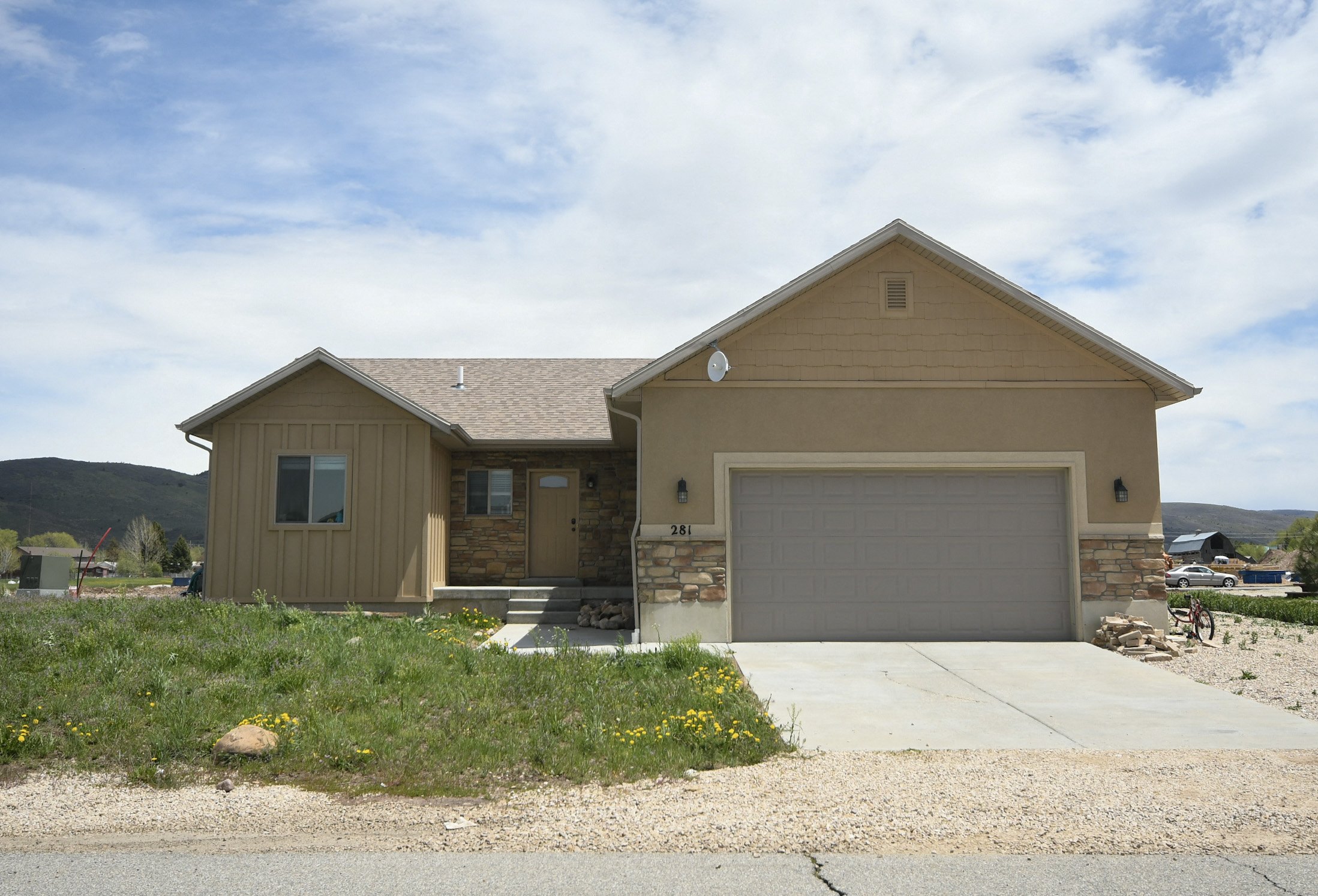 a house with a driveway and a garage door