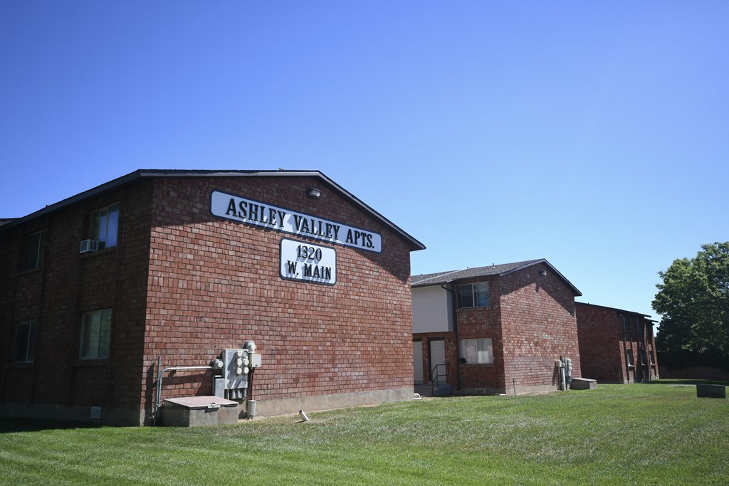 a brick building with a sign on the side of it