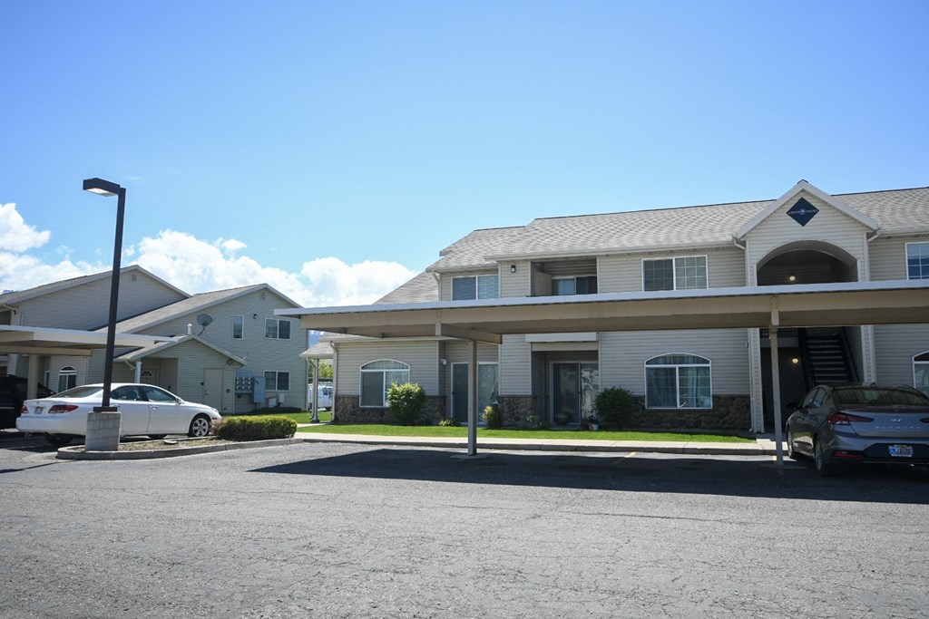 a house with a parking lot in front of it