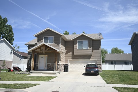 a house with a car parked in front of it