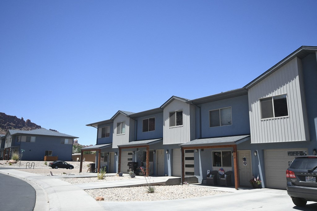 a row of houses on the side of a street