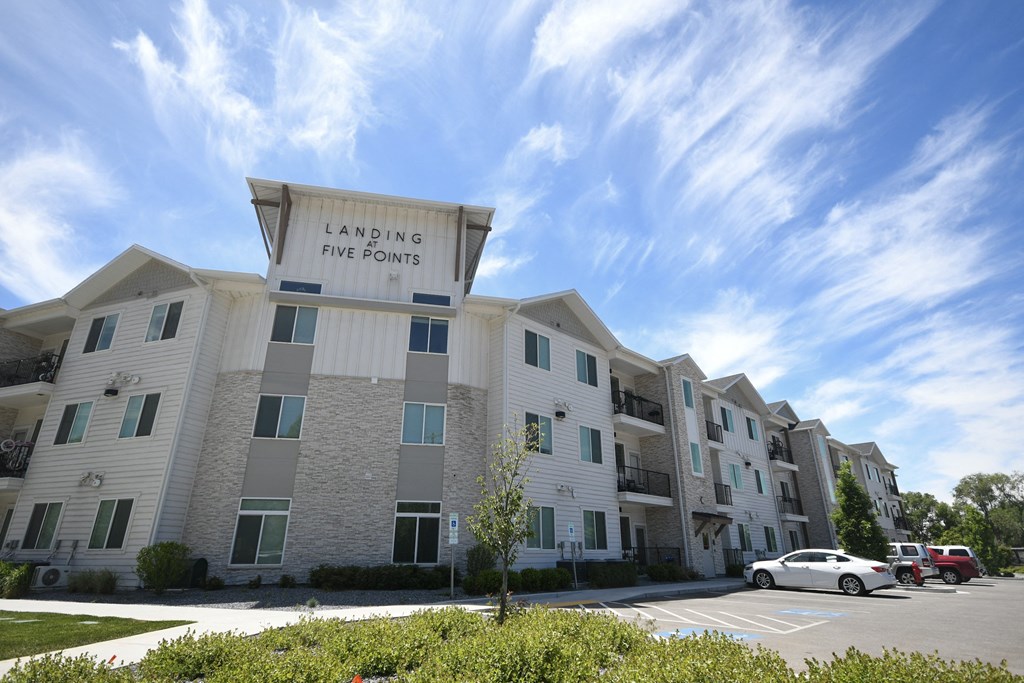 an apartment building with a large sign that reads laughing fire points