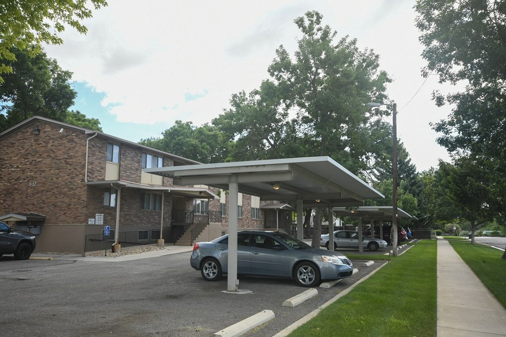 a parking lot with a car parked under a roof
