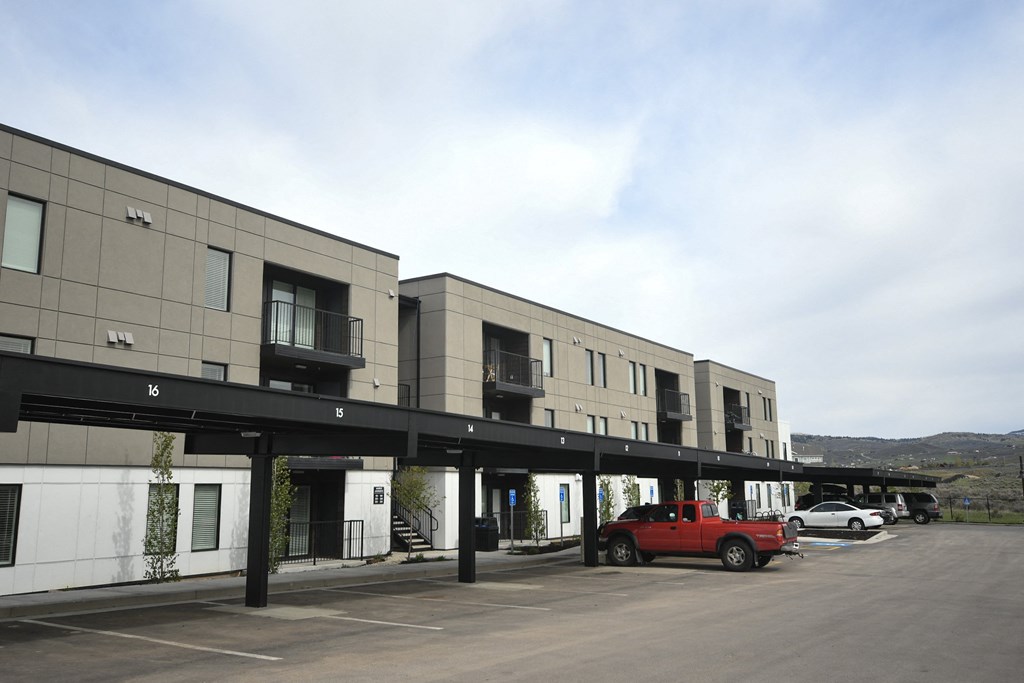a building with a red truck parked in front of it