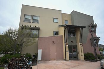 the front of a building with bikes parked in front of it