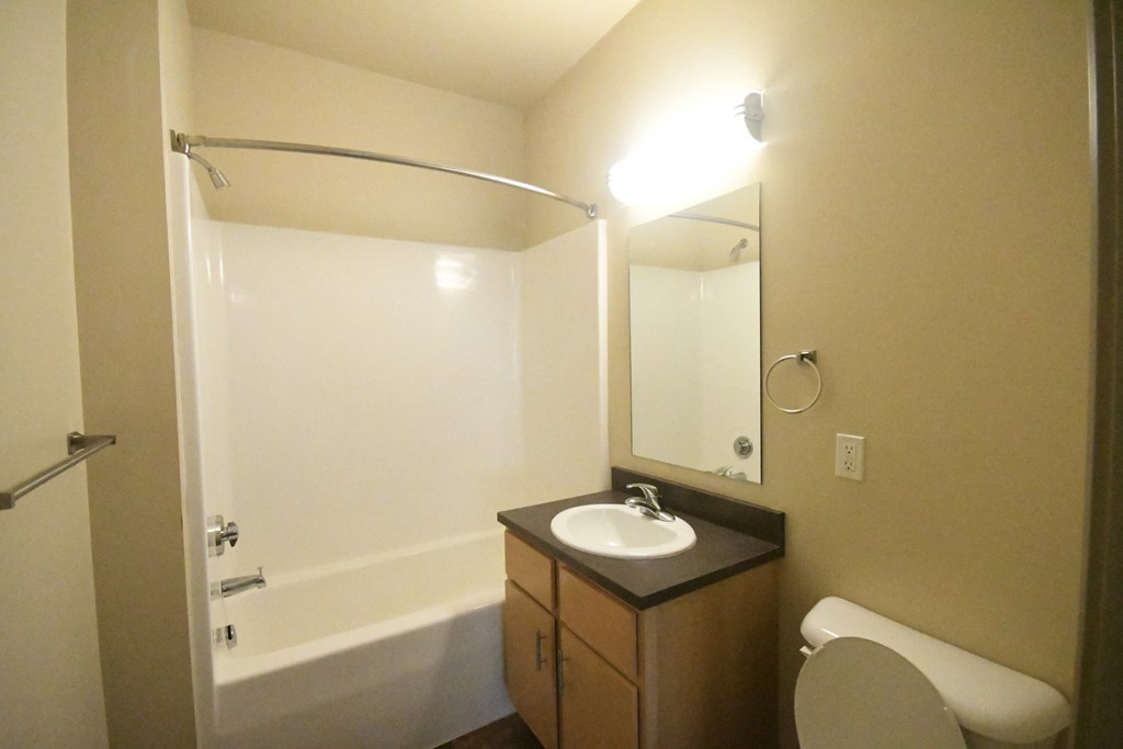a small bathroom with a toilet sink and shower