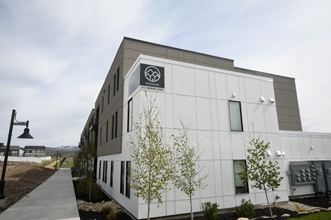 a white building with a logo on the side of it